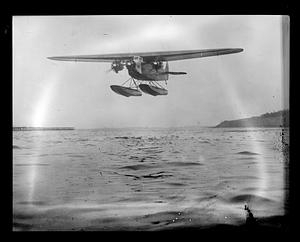 Byrd's South Pole plane taking off from Boston Harbor