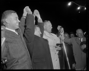 Henry Cabot Lodge, Jr. holding raised hands with John A. Volpe and two other men