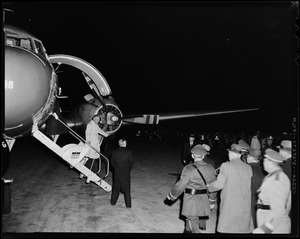 Henry Cabot Lodge, Jr. walking off airplane at Beverly airport