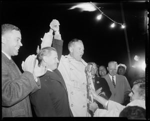 Henry Cabot Lodge, Jr. holding raised hands with gubernatorial candidate John A. Volpe at Beverly airport