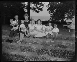 Henry Cabot Lodge, Jr. with wife Emily and six grandchildren in yard of their Beverly home