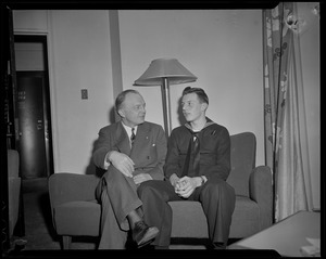 Former Minnesota Governor Harold Stassen talking with a sailor