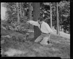 Henry Cabot Lodge, Jr. playing with dog