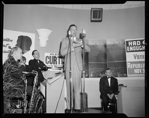 Henry Cabot Lodge, Jr. at microphone, addressing a room