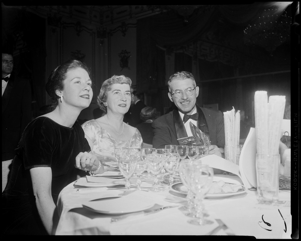 Man and two women seated at table for wine tasting event hosted by Italian Consul General Girolamo Vitelli at Hotel Somerset