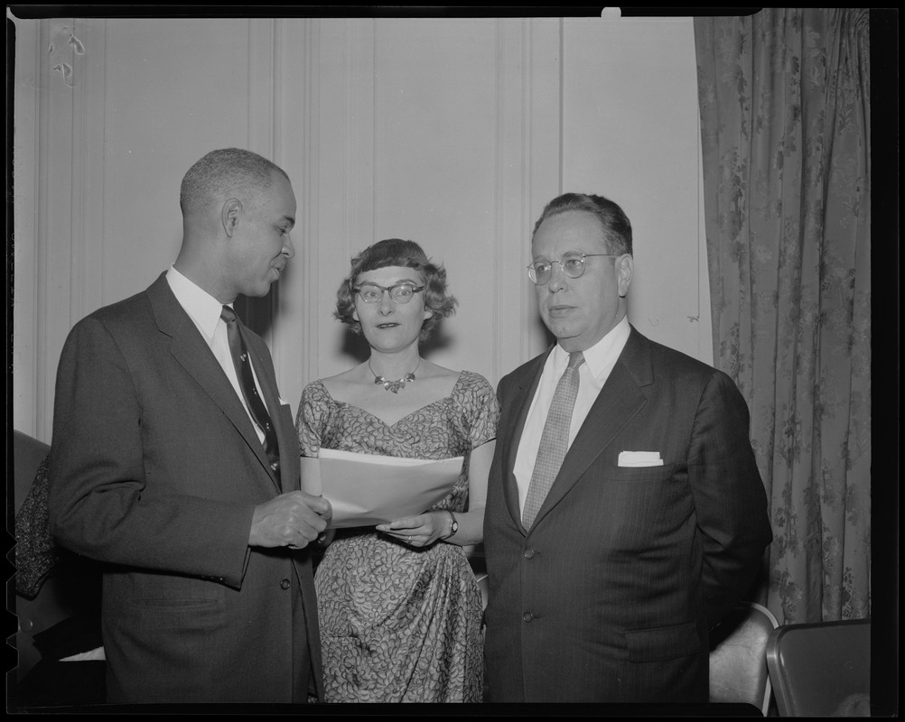 (l-r) Mr. Roy Wilkins, Executive Secretary of the National Association for the Advancement of Colored People, with Leon H. Keyserling, Chairman Council of Economic Advisors under President Truman, both guest speakers at the Roosevelt Day Dinner, as they went over program with Mrs. Paul G. Myerson, Chairman of the State ADA who presided at the dinner held at the Sheraton Plaza