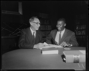 New associate justice of the Supreme Judicial Court of Massachusetts Arthur E. Whittemore looking at documents with law clerk James M. Harkless
