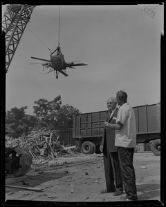 Stanley Blinstrub, South Boston nite club owner, along with foreman John Maher, watch construction of new 1200 car parking lot underway