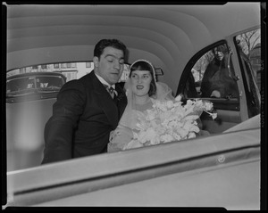 Rocky Marciano and Barbara Cousins seated in car on their wedding day