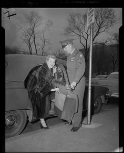 Famed song star Patti Page, arriving at Murphy General Hospital, Waltham, to entertain hospitalized veterans, is assisted from car by master sergeant. Patti found time between shows at Blinstrub's to visit GI friends