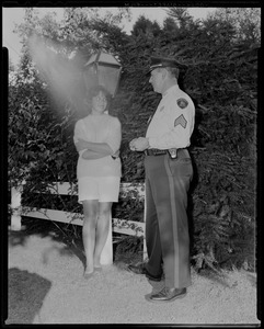 Stand-in for sis. Janet Auchincloss, 15-year-old stepsister of Jacqueline Kennedy, stands at entrance to the Kennedy home in Hyannisport as she gives EXCLUSIVE interview to the Boston AMERICAN. Janet is acting as an effective and charming buffer between Jackie and the outside world