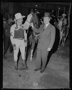 Gene Autry with horse and man in suit