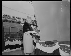 Sponsor Susan Bainbridge Goodale christening USS Bainbridge with champagne at its launch from shipyard in Quincy
