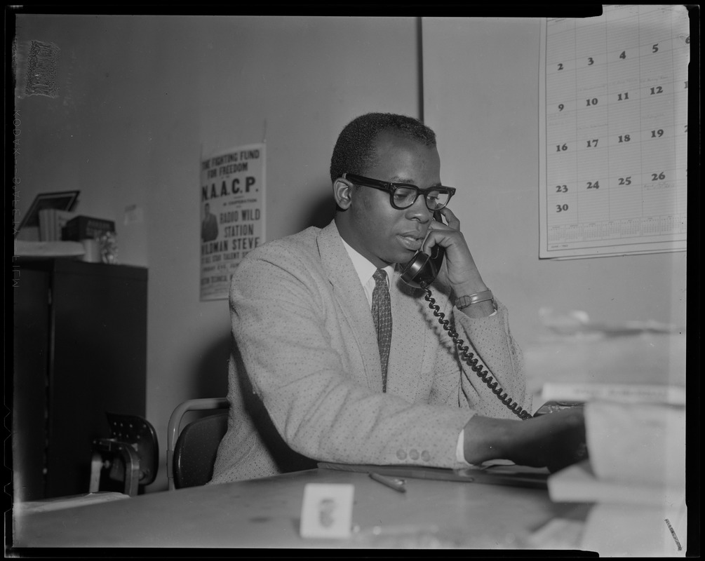 Tom Atkins, executive secretary of the Boston branch of the NAACP, at its headquarters in Roxbury, on the phone