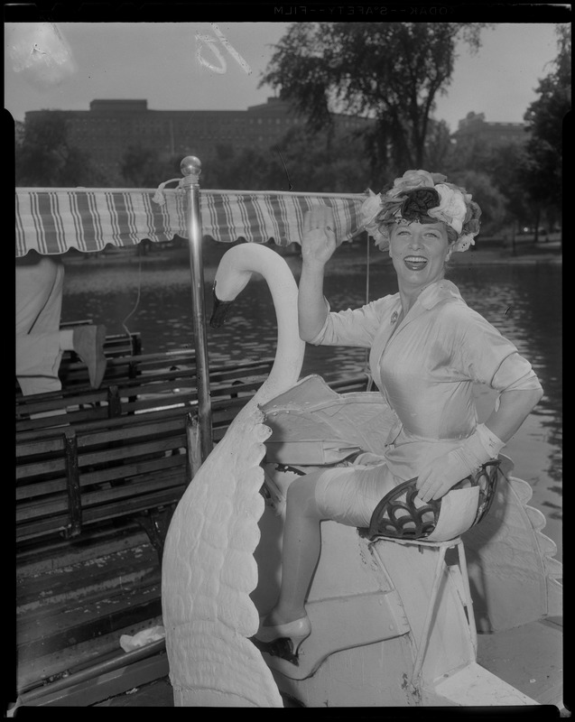 Denise Darcel waving from swan boat in Boston Public Garden