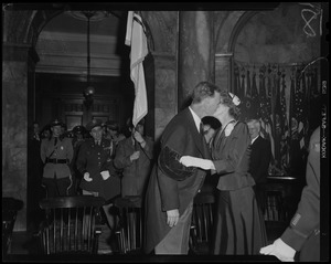 Gov. Christian Herter and Mary Pratt Herter kissing at his inauguration