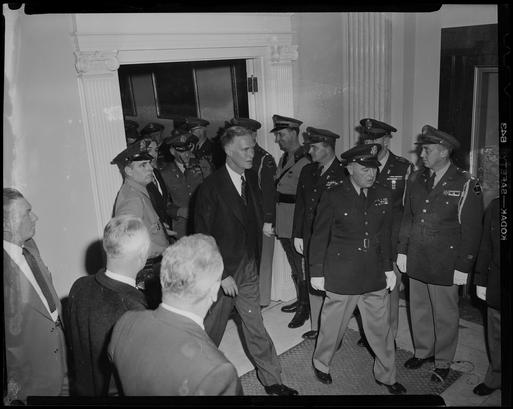 Gov. Christian Herter with men in military uniforms