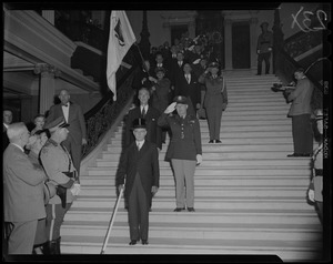Gov. Christian Herter descending Grand Staircase of State House with procession at inauguration