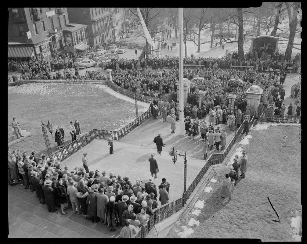 View of crowd on Beacon Street and exterior stairs of Massachusetts State House for inauguration of Gov. Herter