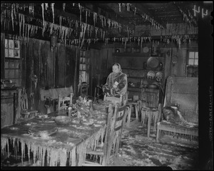Mrs. Barrie W. Blake standing in "The Old Kitchen" of Wayside Inn after fire
