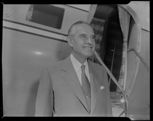 New York Governor Averell Harriman standing near plane