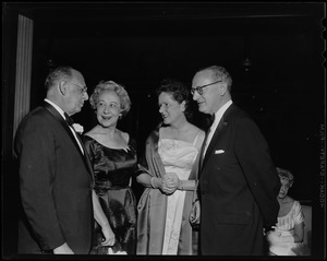 Sidney R. Rabb and Esther V. Rabb talking to other man and woman at the third annual Ambassador's Ball