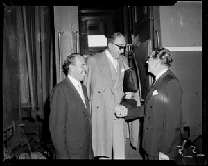 Trieste Mayor Gianni Bartoli and Italian Consul General Dr. Giovanni Formichella shaking hands, with city greeter Jack Brown