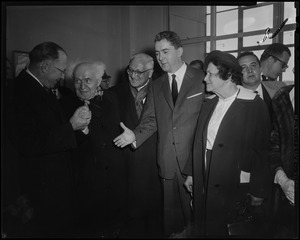 Lt. Governor Robert F. Murphy and David Ben-Gurion clasping hands, with Brandeis President Dr. Abram Sachar, Deputy Mayor John McMorrow, and Paula Ben-Gurion