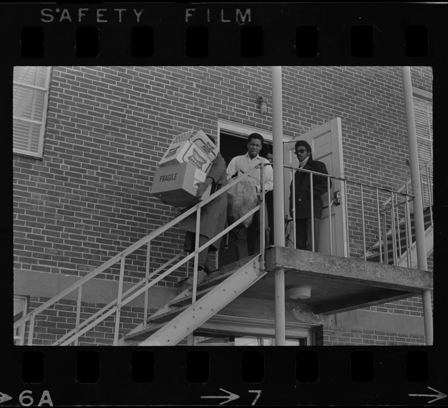 Black student protesters at Brandeis University removing trash from occupied Ford Hall