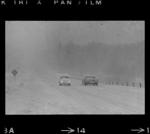 Cars on snowy road during nor'easter