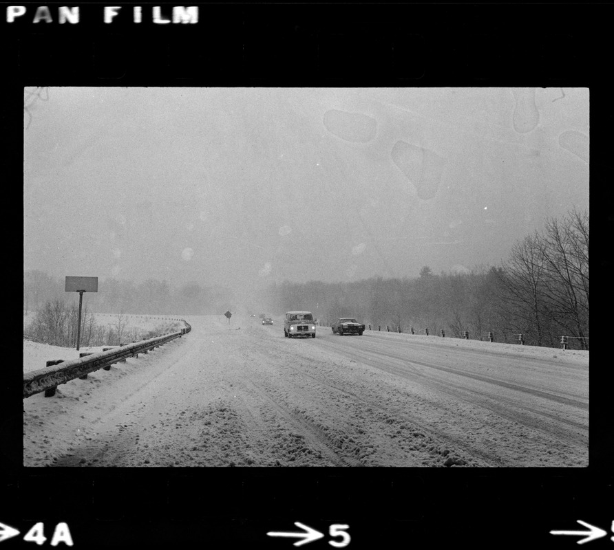 Cars on snowy road during nor'easter