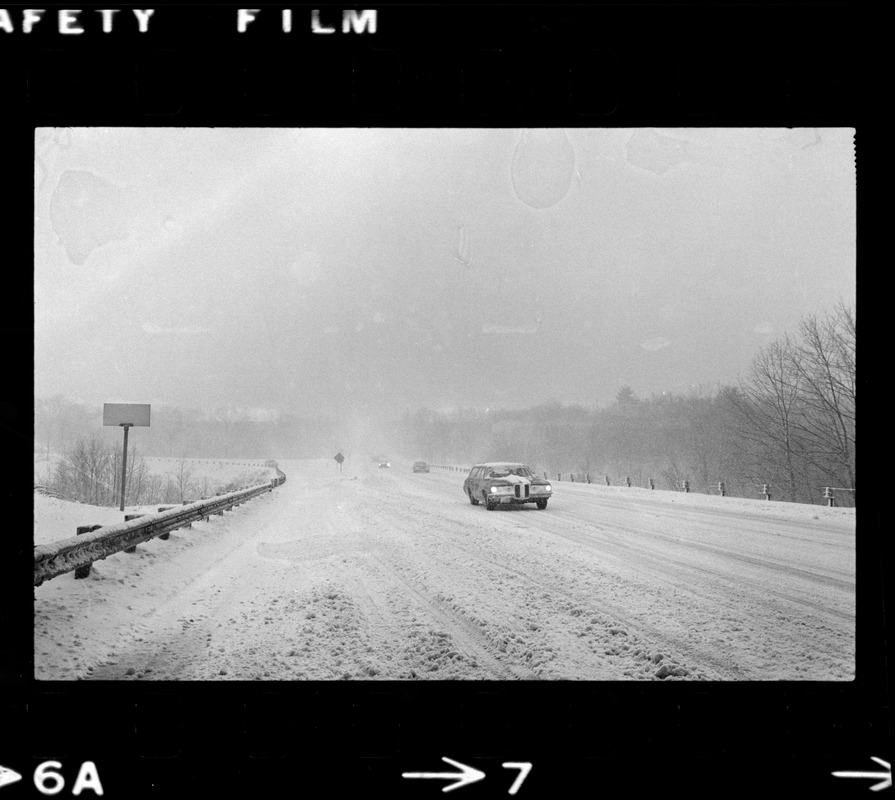 Cars on snowy road during nor'easter