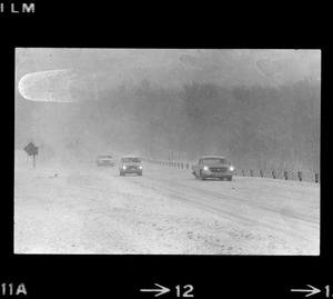 Cars on snowy road during nor'easter