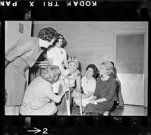 Mary E. Fantasia, Toni Peabody, Lady Bird Johnson, and Joan Kennedy with a patient at Kennedy Memorial Hospital