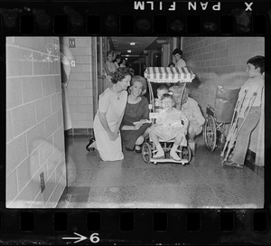 This trio of well-known ladies visited Kennedy Memorial Foundation Warren St., Brighton yesterday and spent several hours cheering up young patients. Shown with one of patients are Mrs. Lyndon B. Johnson, wife of V. P. Johnson, Mrs. Joan Kennedy, wife of Sen. Edward Kennedy, and Mrs. Toni Peabody, wife of Gov. Peabody