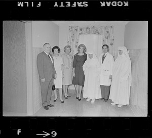 Unidentified man, Lady Bird Johnson, Toni Peabody, Joan Kennedy, Dr. Charles Pryles, and two nuns at Kennedy Memorial Hospital
