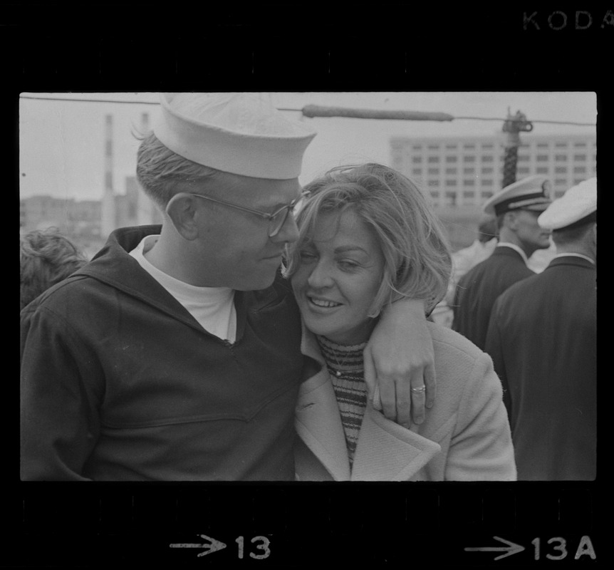 Sailor and woman at homecoming of U. S. S. Boston at South Boston Naval Annex