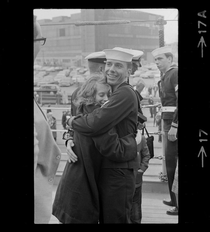 Sailor and woman at homecoming of U. S. S. Boston at South Boston Naval Annex