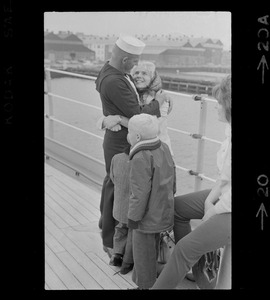 Sailor and woman at homecoming of U. S. S. Boston at South Boston Naval Annex