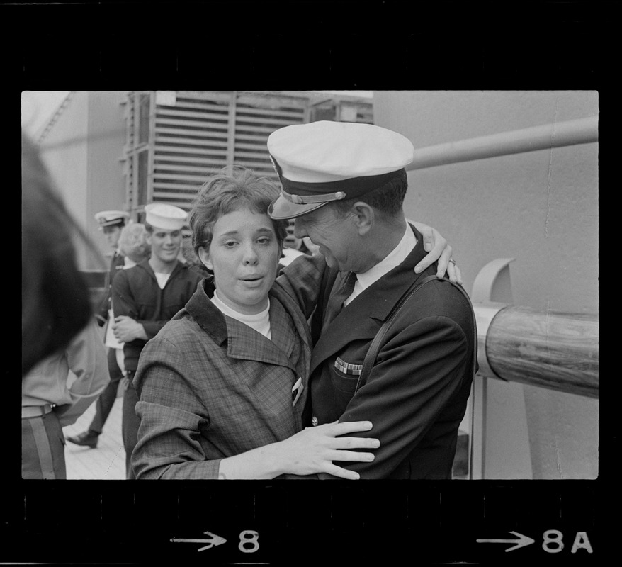 Sailor and woman at homecoming of U. S. S. Boston at South Boston Naval Annex