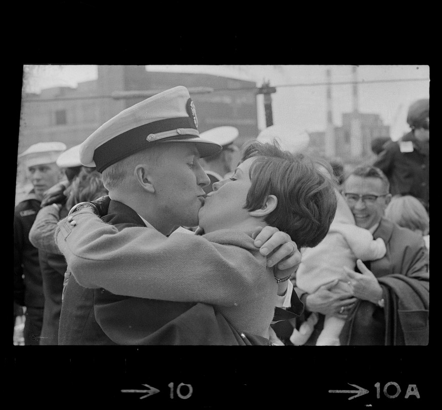 Sailor and woman at homecoming of U. S. S. Boston at South Boston Naval Annex