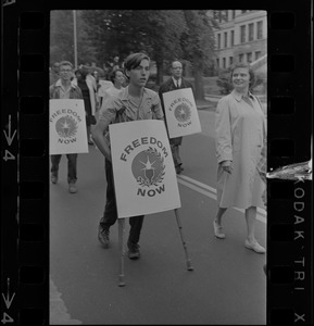 A marcher on crutches joins the Springfield parade of civil rights demonstrators