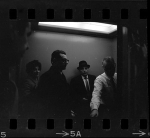 People in elevator of Federal Building in Boston on day of arraignment of the "Boston Five" on charges of aiding draft resisters