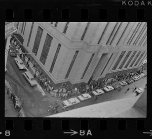 Supporters of Dr. Spock, and some who opposed his stand on the Vietnam war, marched around the Federal Building in Boston while the doctor and four other foes of the fighting were appearing at a hearing