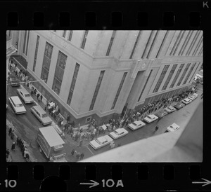 Supporters of Dr. Spock, and some who opposed his stand on the Vietnam war, marched around the Federal Building in Boston while the doctor and four other foes of the fighting were appearing at a hearing