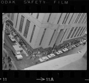 Supporters of Dr. Spock, and some who opposed his stand on the Vietnam war, marched around the Federal Building in Boston while the doctor and four other foes of the fighting were appearing at a hearing