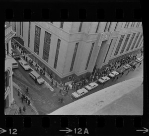 Supporters of Dr. Spock, and some who opposed his stand on the Vietnam war, marched around the Federal Building in Boston while the doctor and four other foes of the fighting were appearing at a hearing