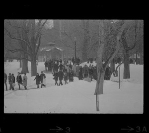 Anti-draft demonstration marching across Boston Common in snow