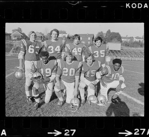 Arlington High School football players unidentified, Jerry Jacobs, possibly Dave Seward, Wayne Michealsen, Bob Taccini, unidentified, unidentified, and Bill Coleman