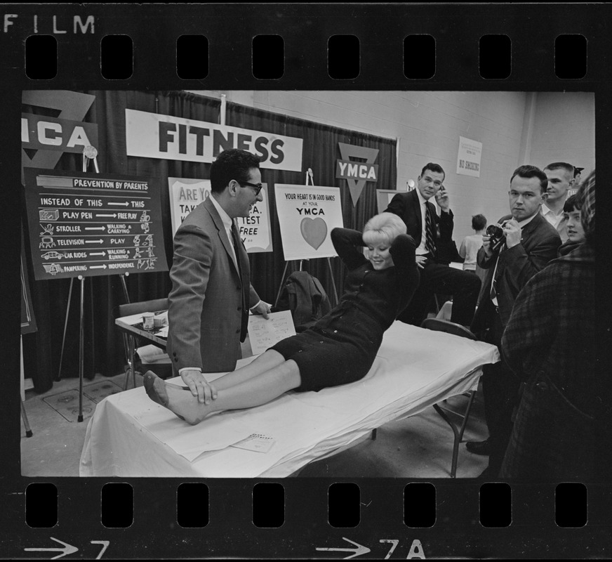 Exercises demonstrated by Nick Tranquillo and Marjorie Santoro at YMCA booth at War Memorial Auditorium